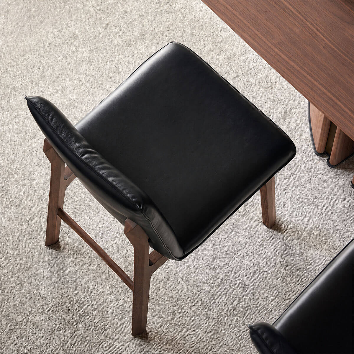 Rear view of the Loren Leather Dining Chair showing the sculptural timber frame