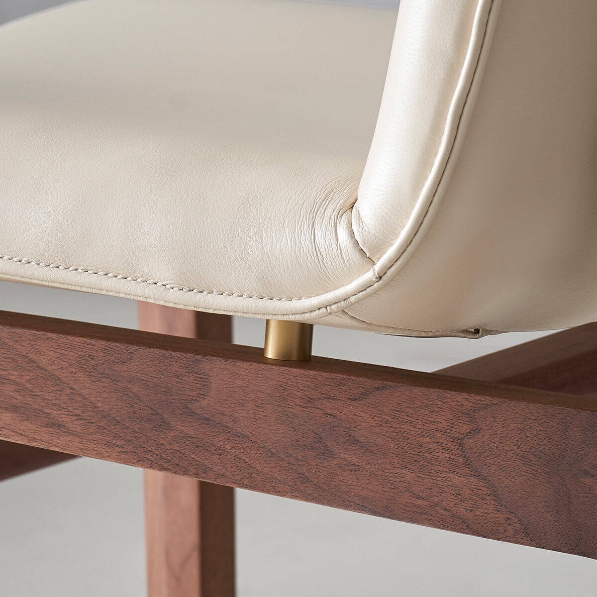 Solid brass accent detail on the Loren Leather Dining Chair