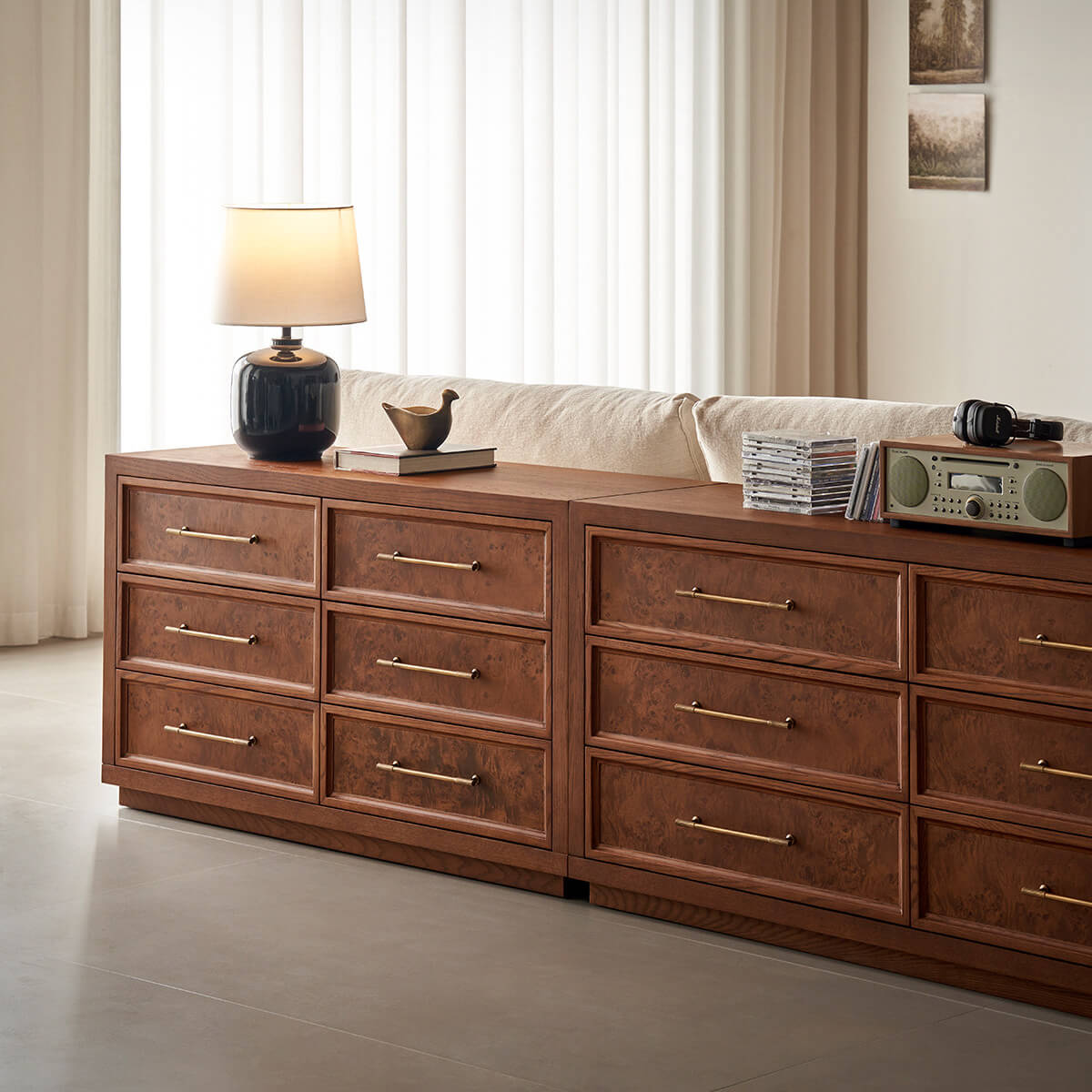 Louvre burl wood chest of drawers and matching dresser in a living room