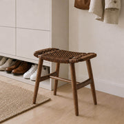 Malmo stool in walnut used as an entryway shoe changing bench with a modern shoe cabinet