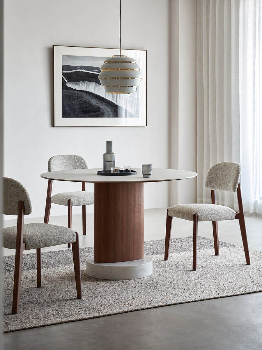 Malo solid ash and woven fabric dining chairs around a dining table