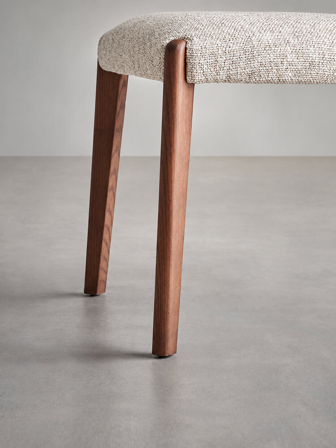 Solid ash leg detail on Malo fabric dining chair