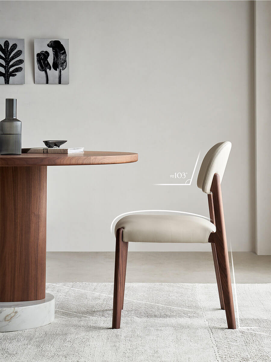 Side profile of Malo leather dining chair with curved backrest