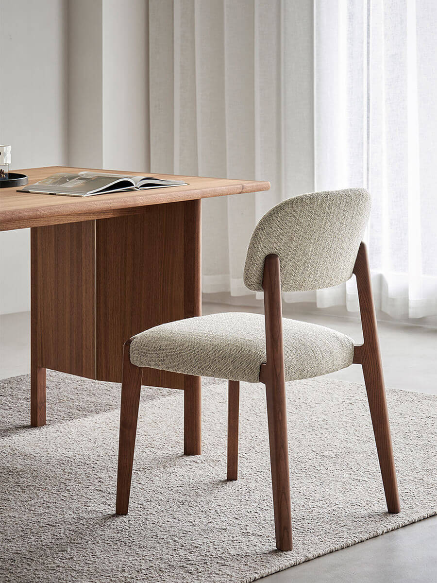 Malo solid ash dining chair with textured woven fabric upholstery