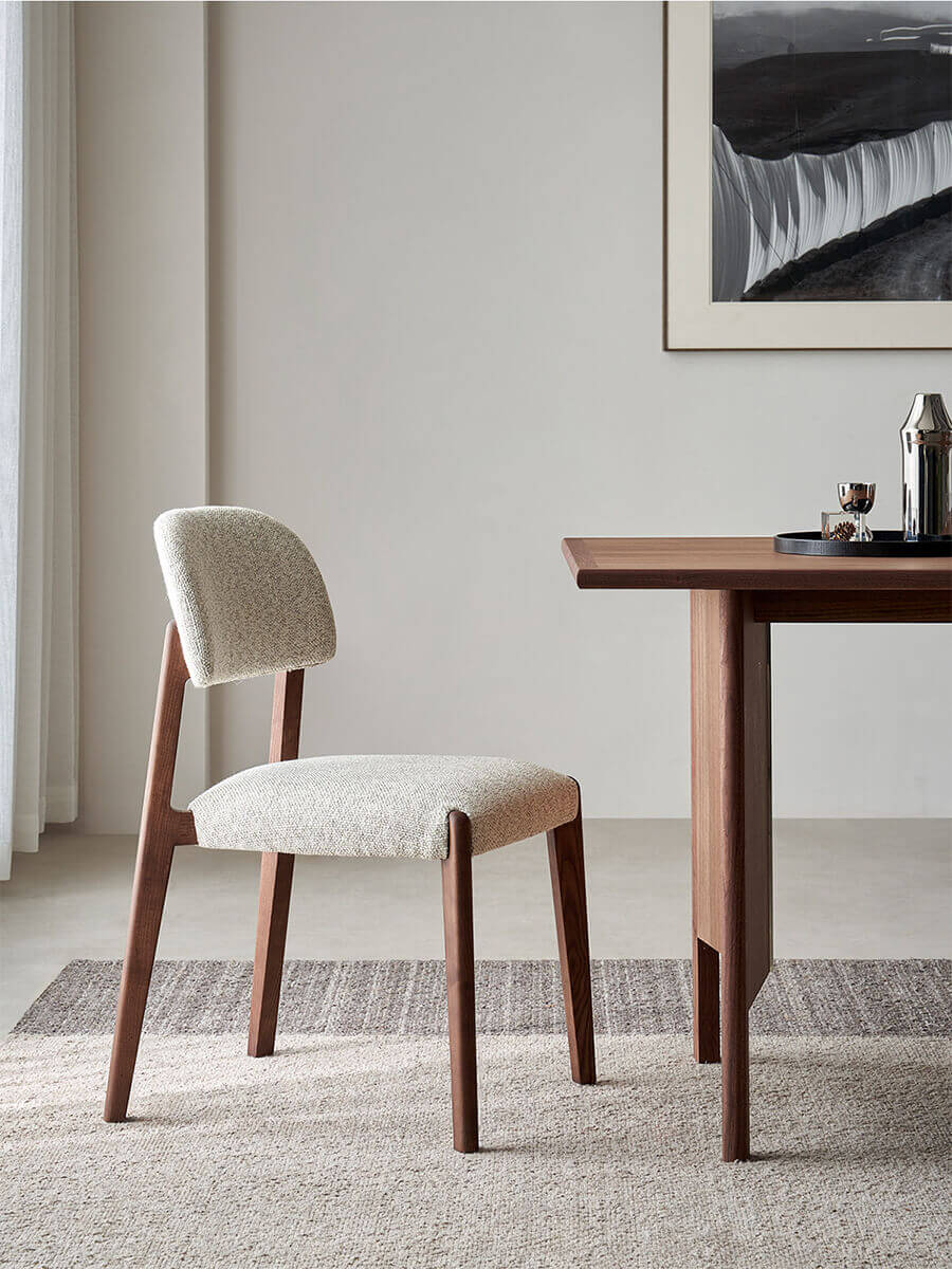 Malo solid ash dining chair with textured woven fabric upholstery