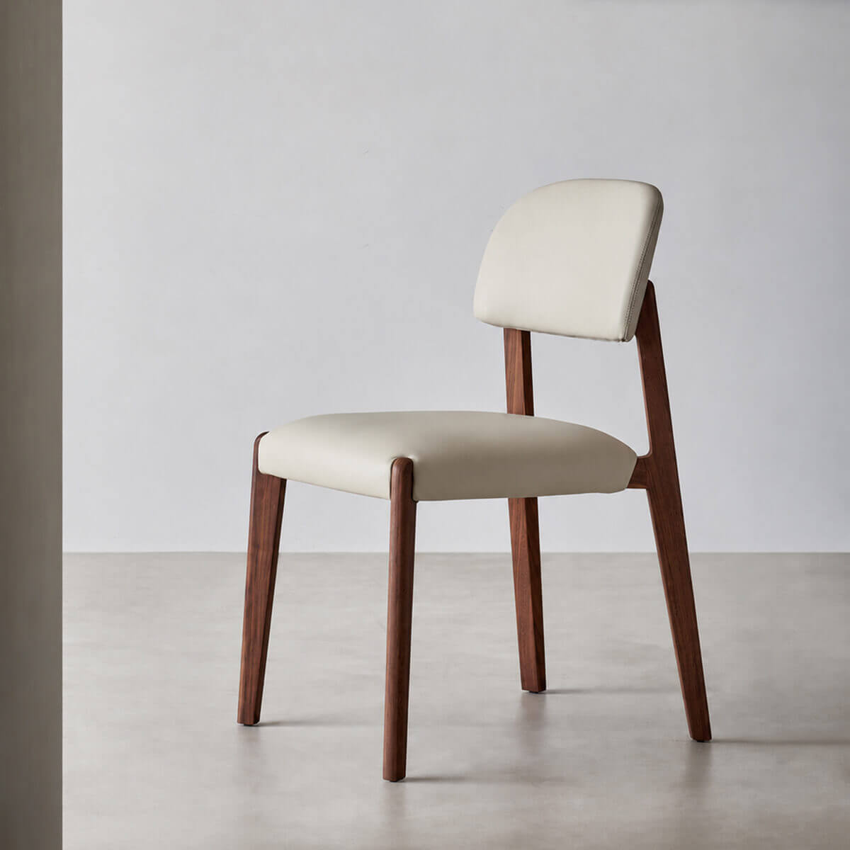 Malo solid black walnut dining chair with top-grain leather upholstery