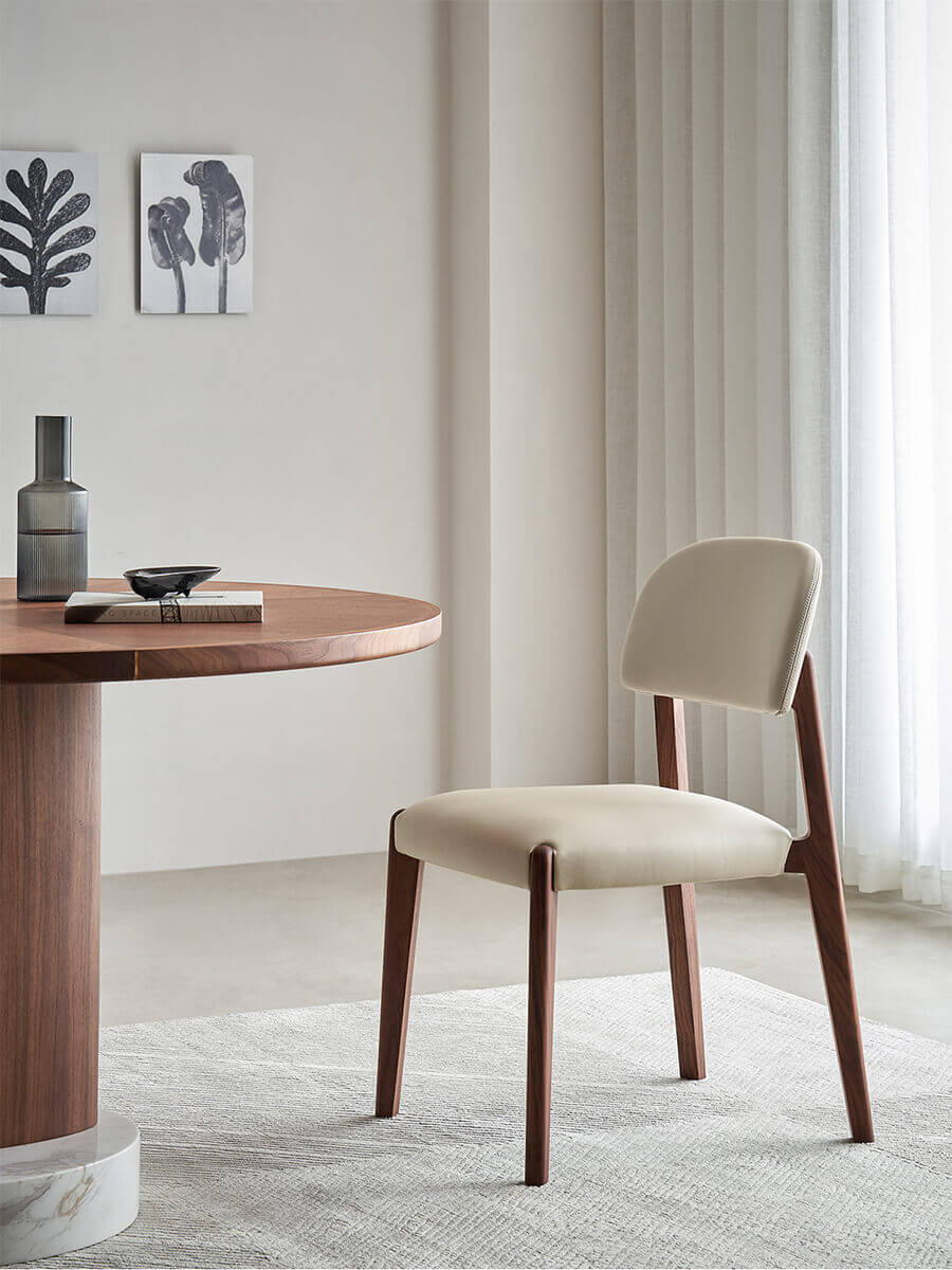 Malo walnut and leather dining chair in a contemporary dining room