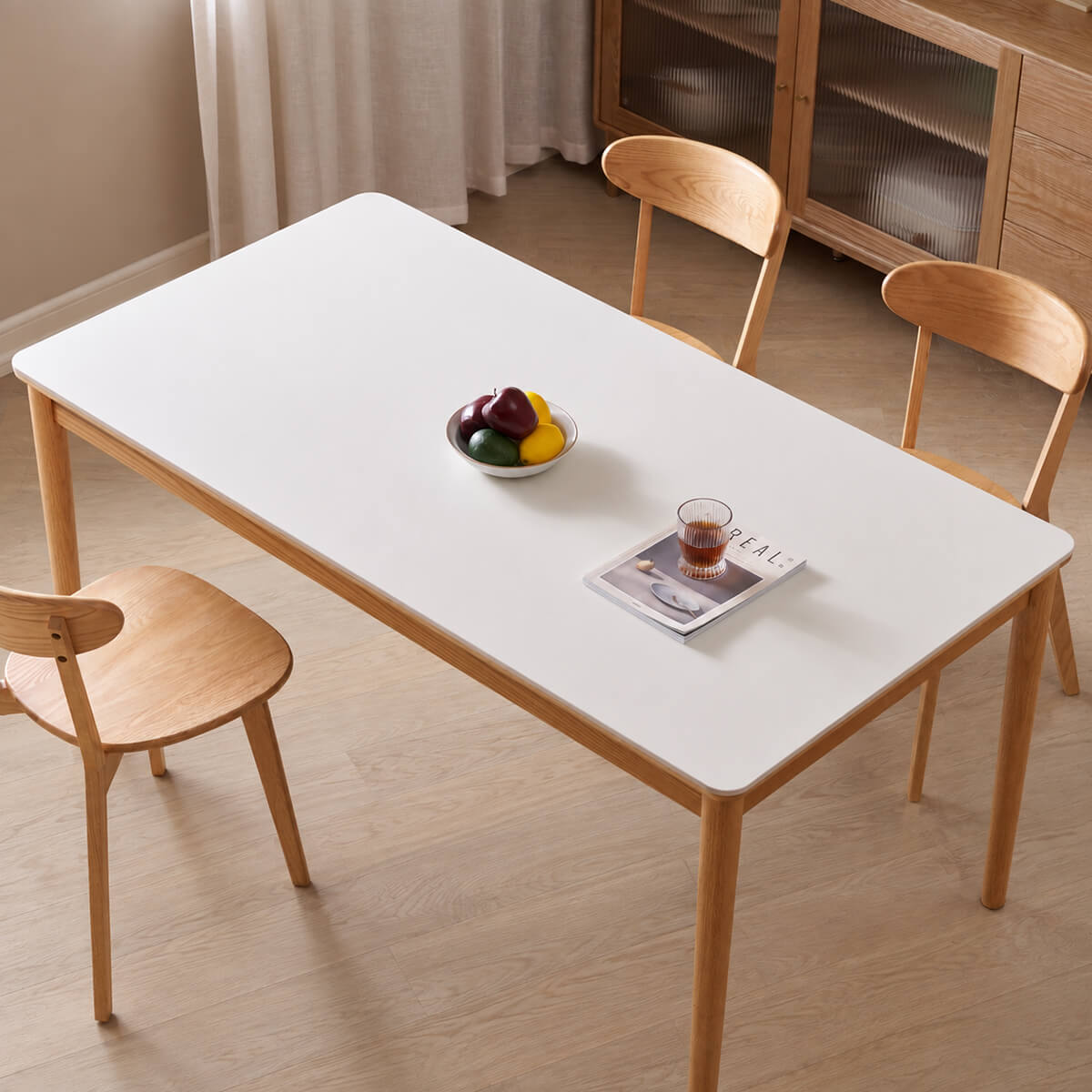 Mora solid oak dining table showing white sintered stone tabletop