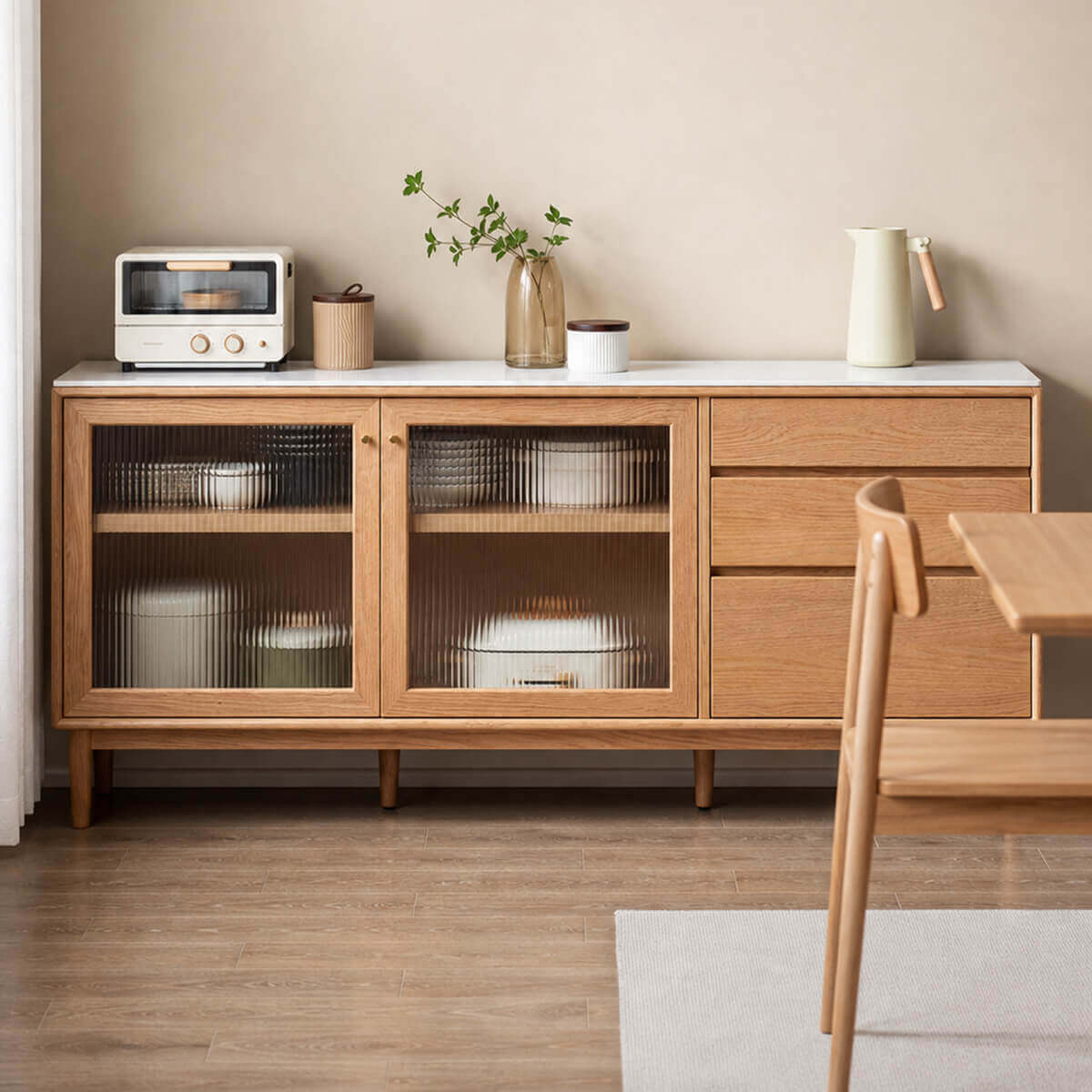 Mora Solid Oak Sideboard used as dining room storage with tableware and glassware