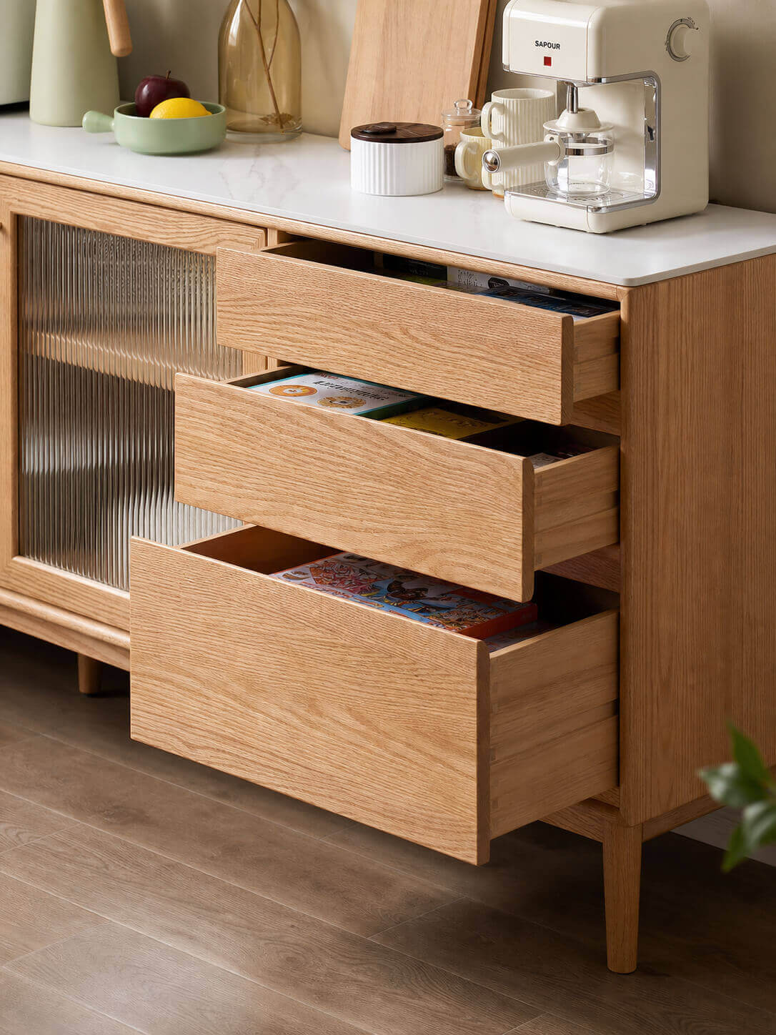 Open drawers of the Mora Solid Oak Sideboard showing practical storage