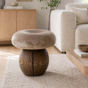Mushroom tree root stool with upholstered seat in a contemporary living room