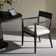 Noir Dining Chair with black wood frame and leather seat