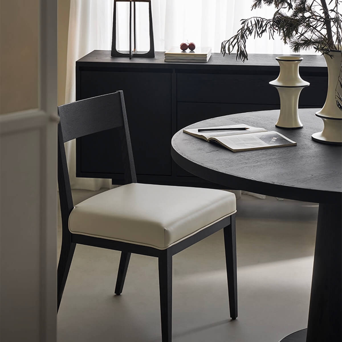 Noir Dining Chair leather seat in dining room setting