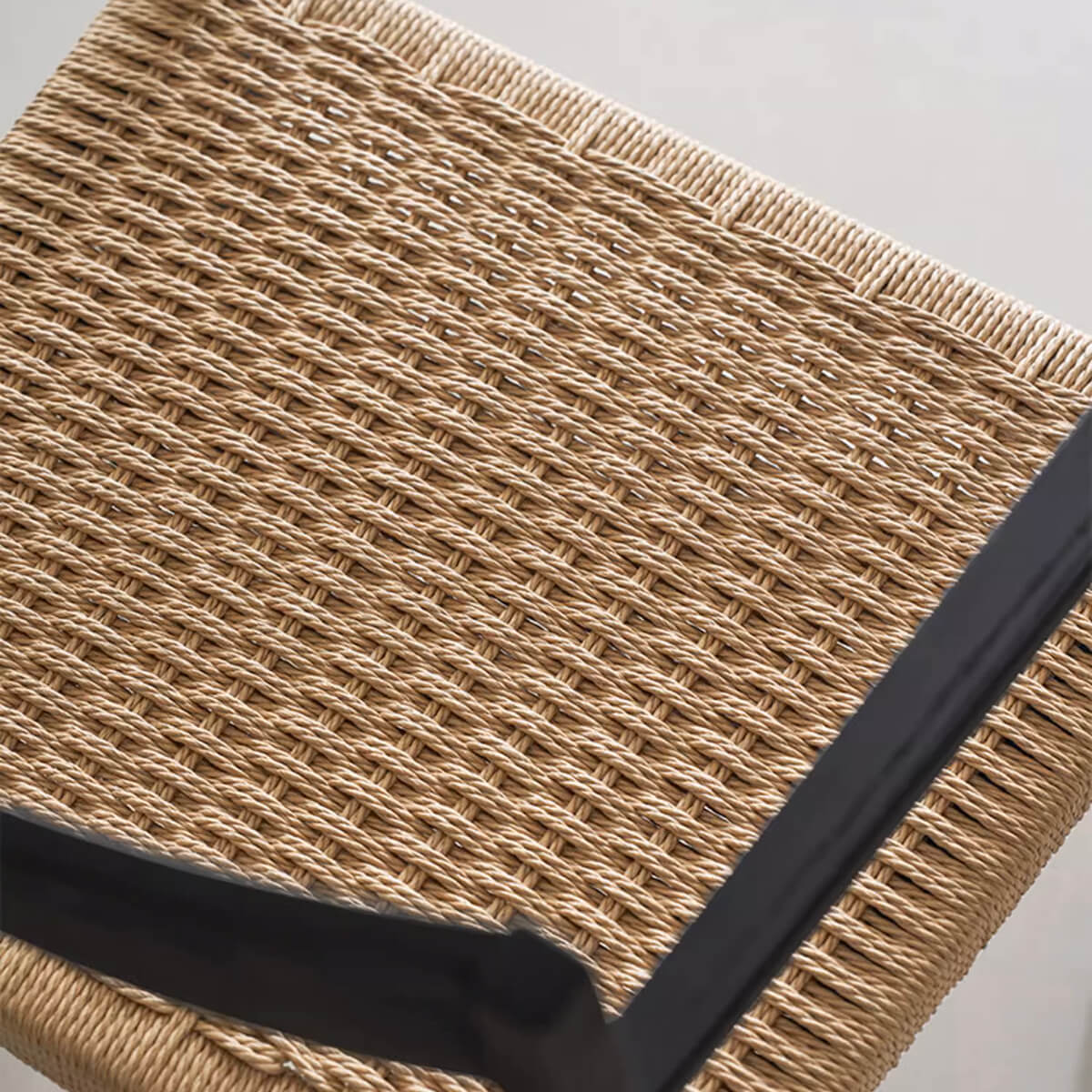 Handwoven paper cord seat detail of Noir Dining Chair