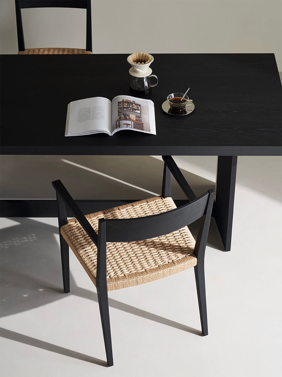 Handwoven paper cord seat detail of Noir Dining Chair