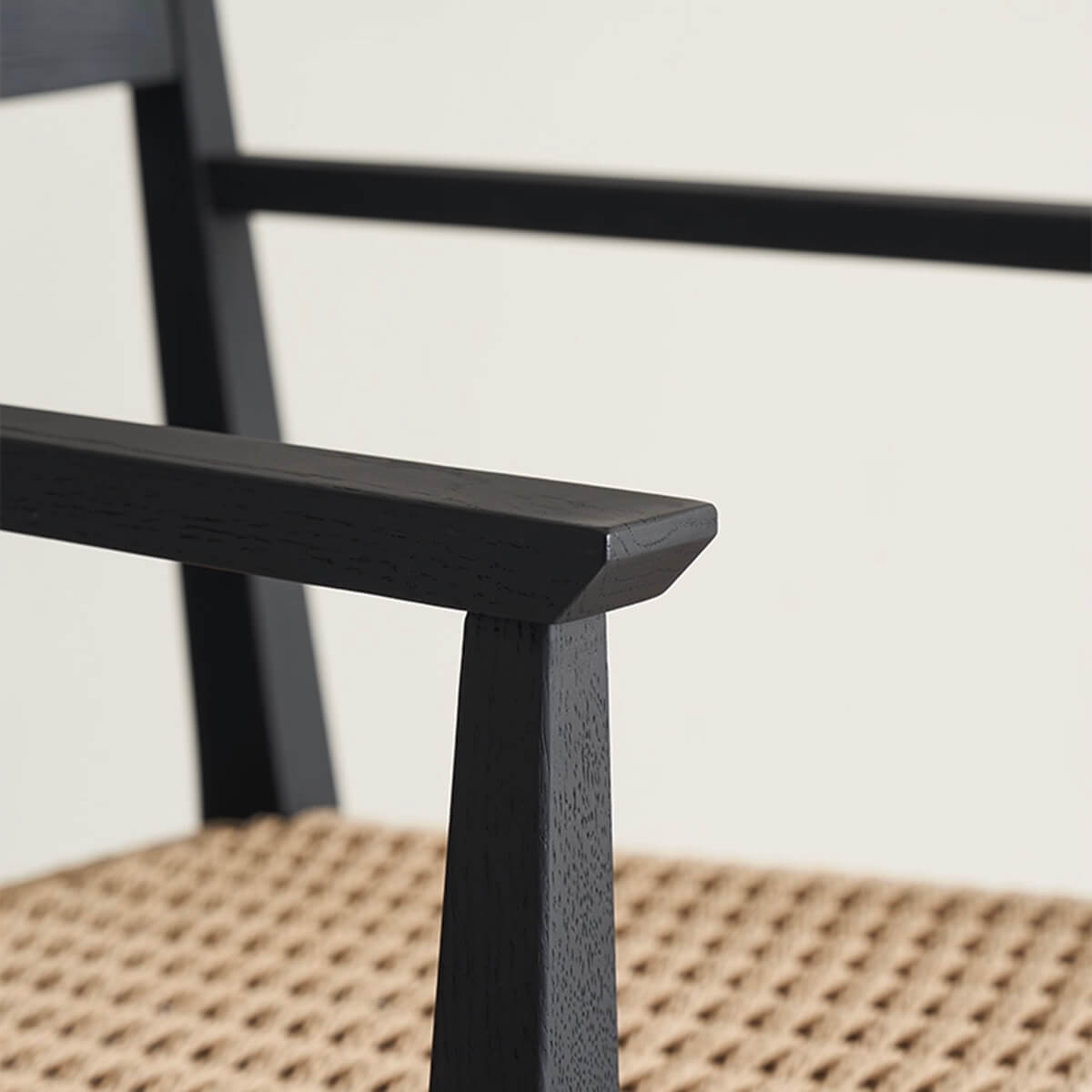 Solid wood armrest detail of Noir Dining Chair