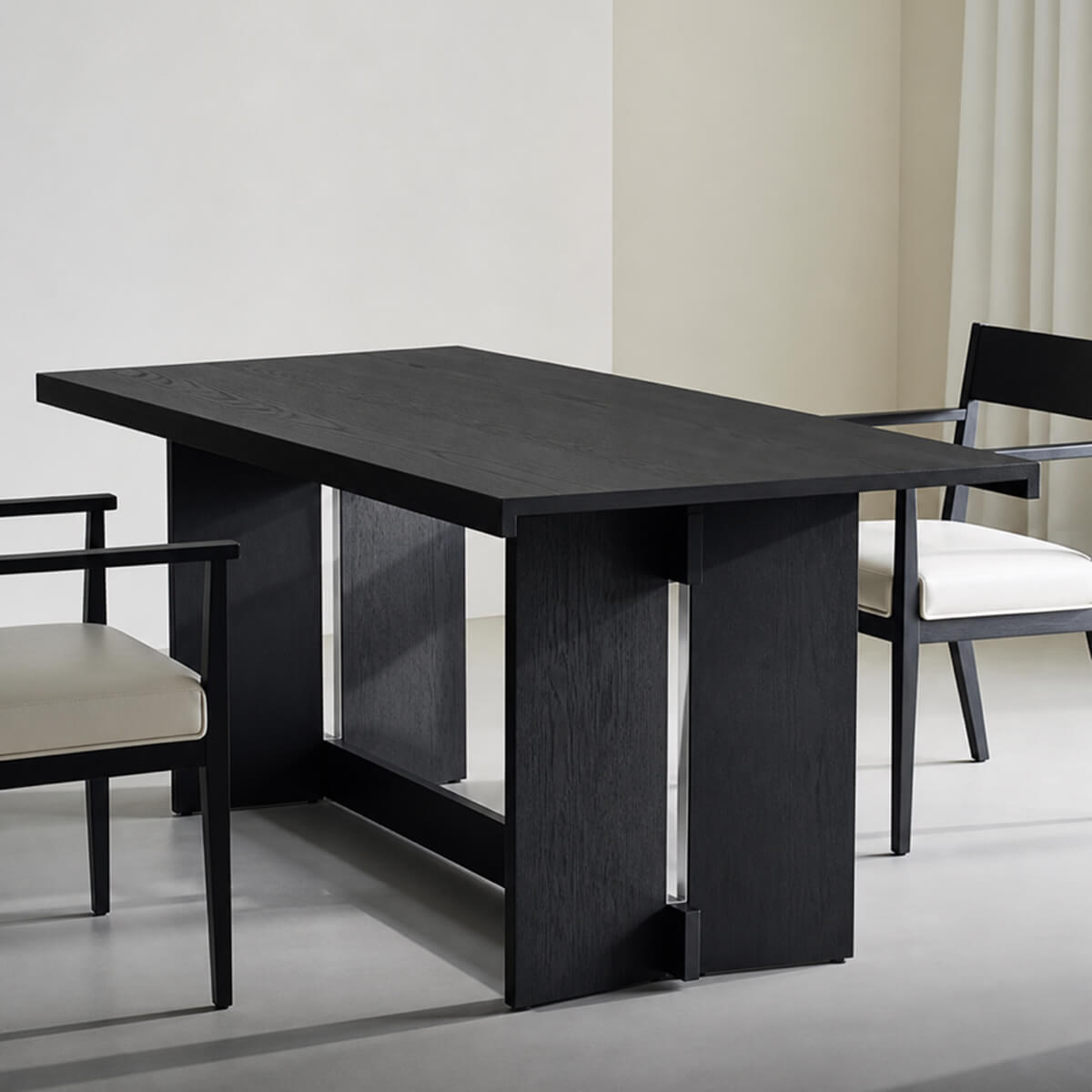 Noir Dining Table in black oak veneer with architectural base design