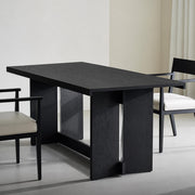 Noir Dining Table in black oak veneer with architectural base design