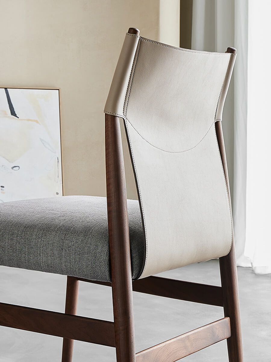 Back view of Nora dining chair showing saddle leather backrest and timber frame