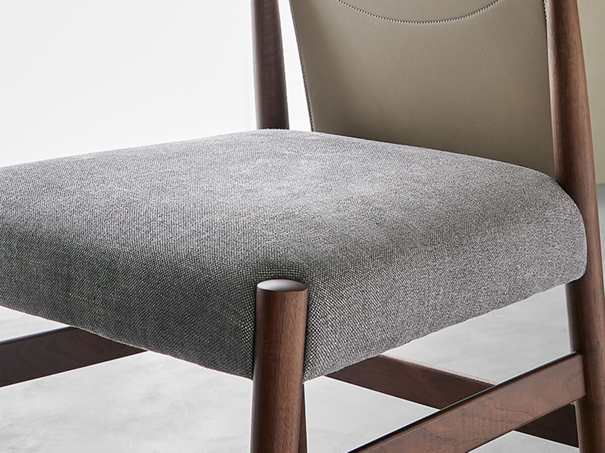 Close-up detail of upholstered seat on Nora dining chair