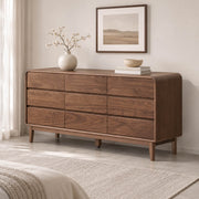 Norwich Solid Walnut Chest of Drawers – 9-drawer wide dresser in a modern bedroom
