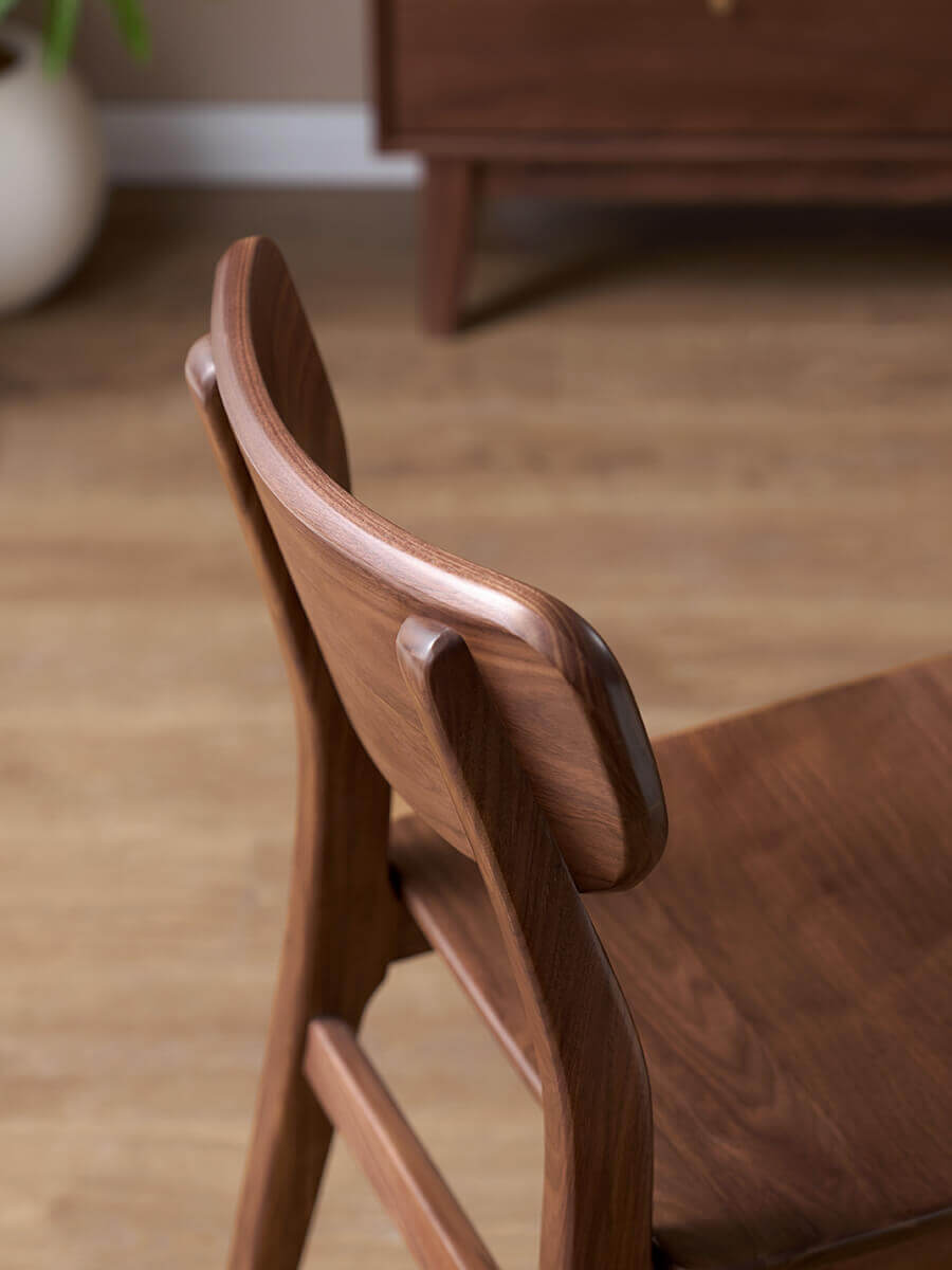 Oden Dining Chair solid walnut backrest and curved rear supports