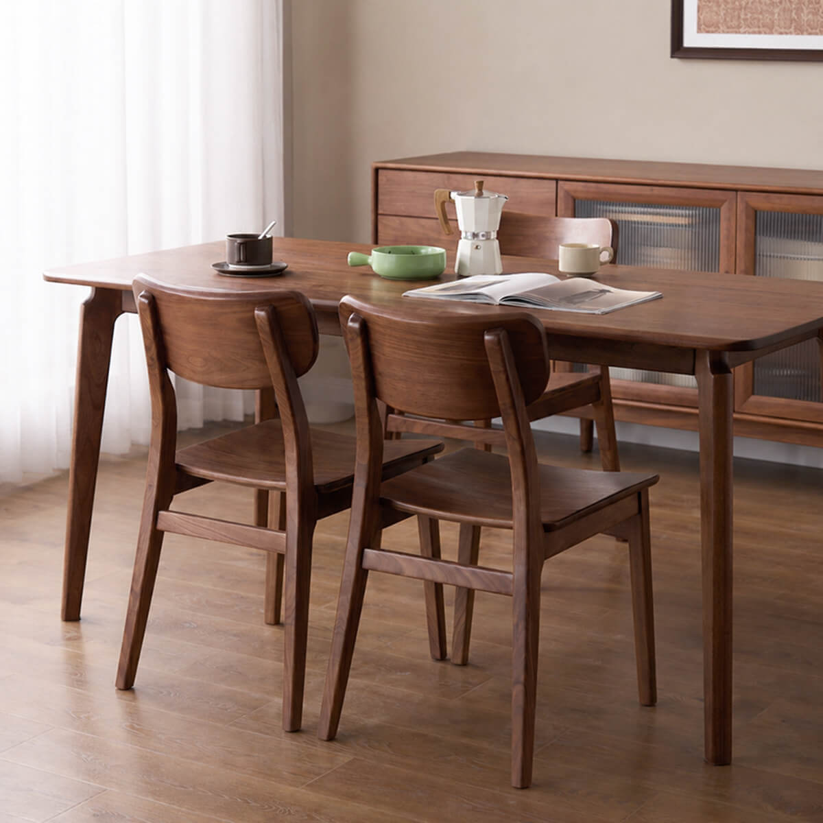 Oden Solid Walnut Dining Chairs in a walnut dining setting