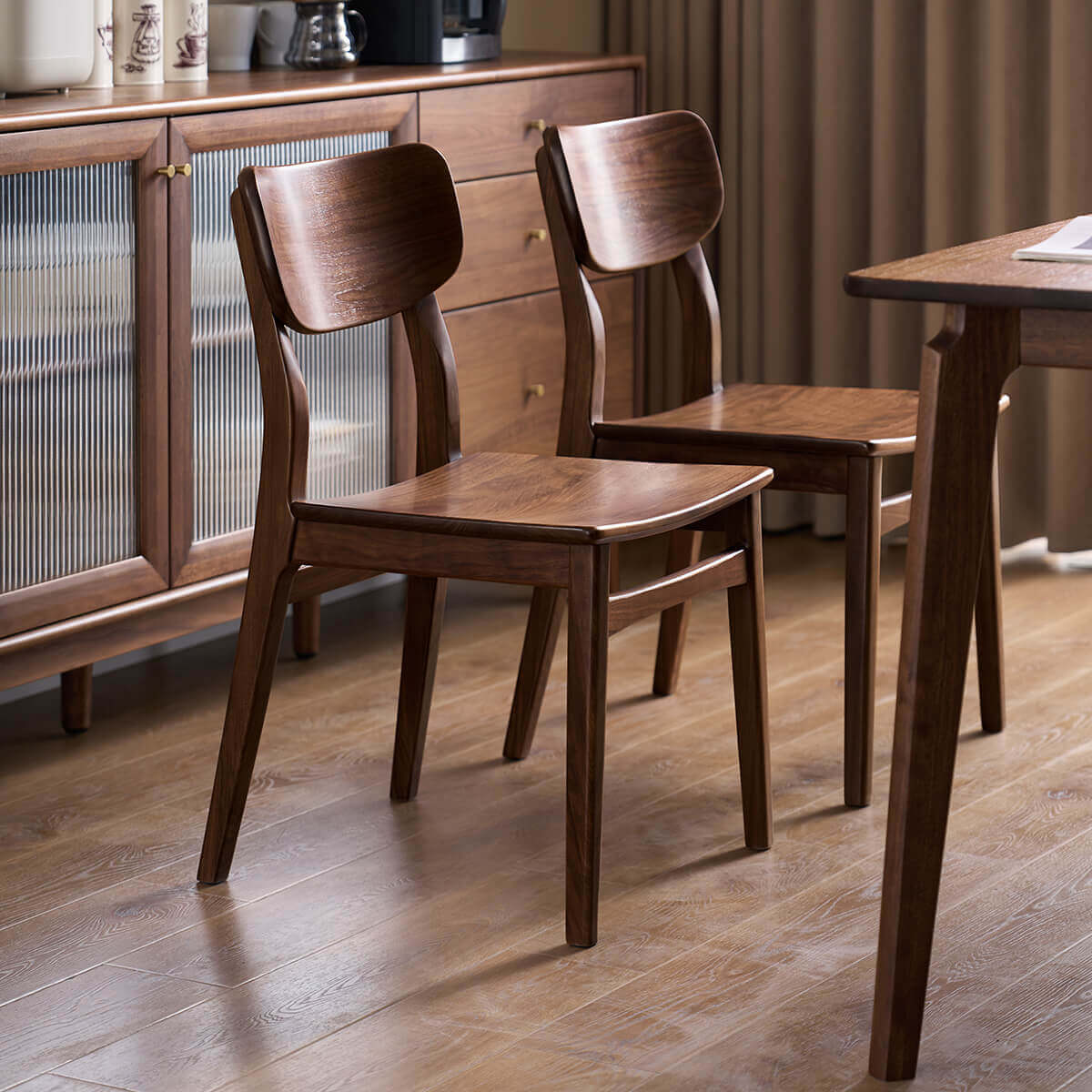 Oden Solid Walnut Dining Chairs with matching walnut furniture