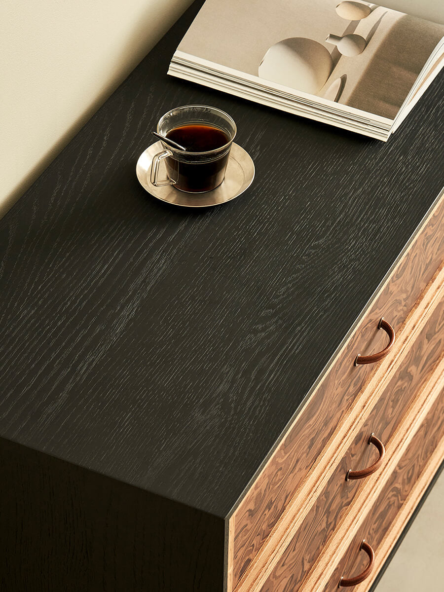Orven black-finished cabinet top and burl-effect drawer detail