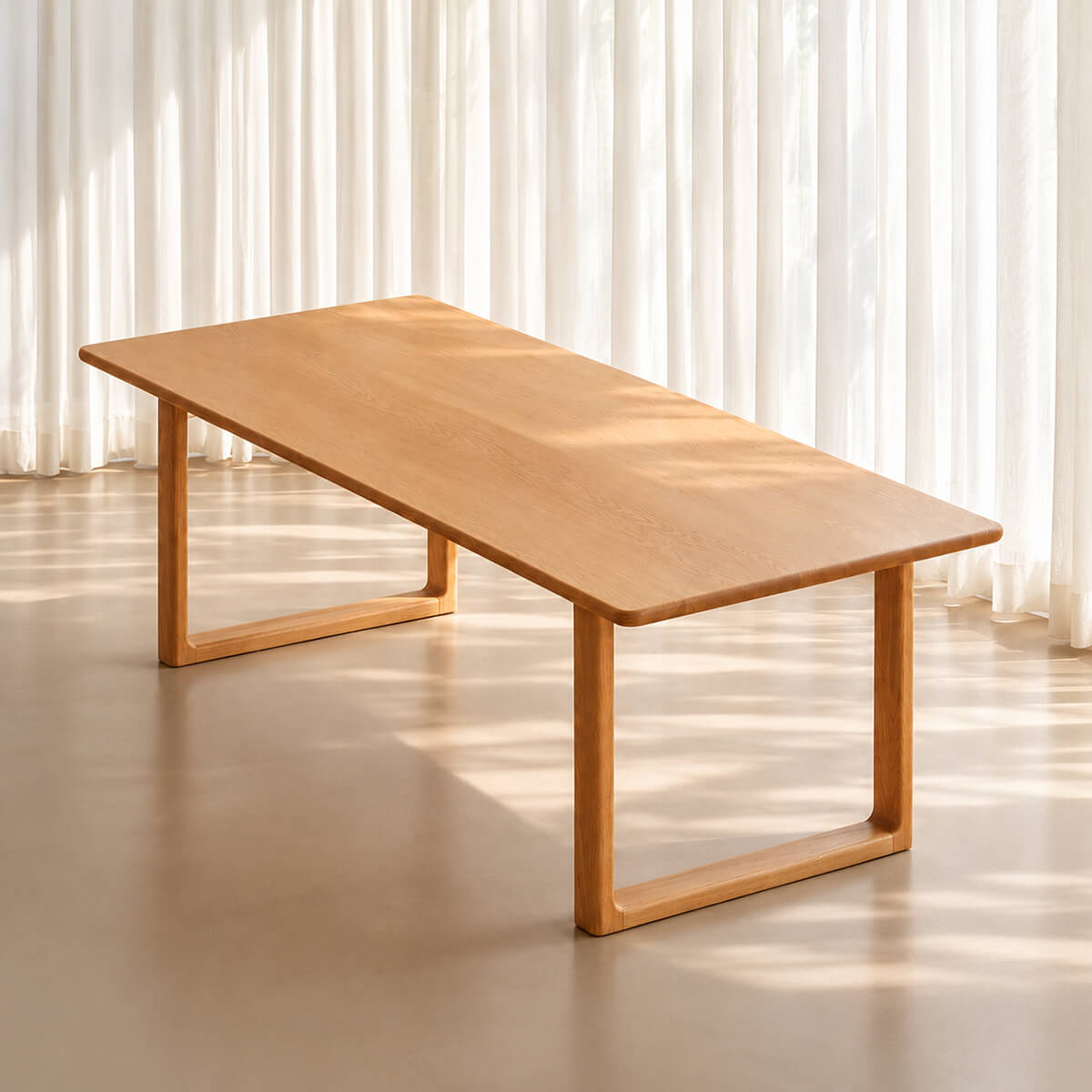 Oscar solid oak dining table in Natural Oak finish, featuring a rounded rectangular tabletop and open-frame timber legs