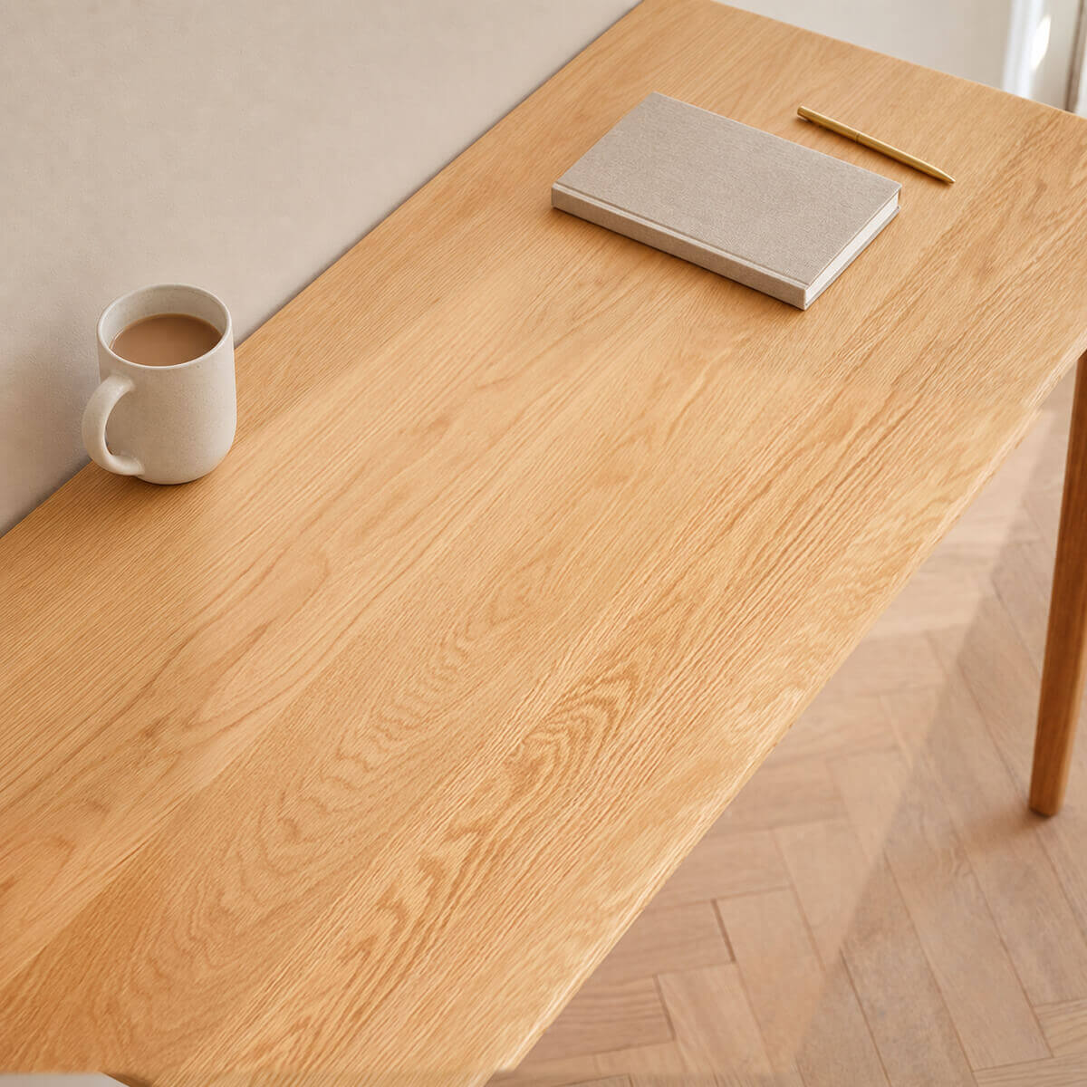 Close-up of the Oslo Solid Oak Desk showing the solid oak tabletop grain