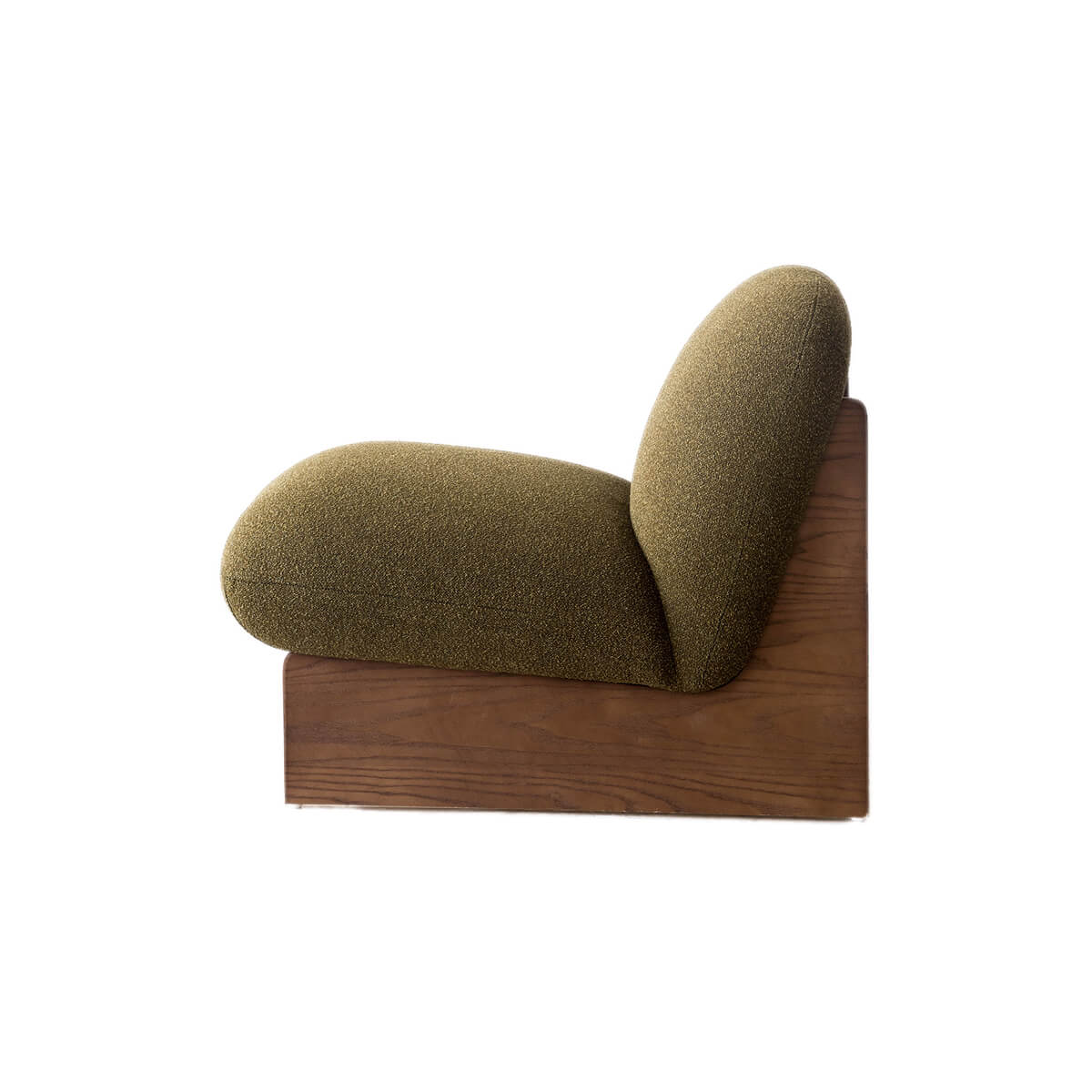 Side view of the Pebble Accent Chair showing its curved upholstered form and timber base