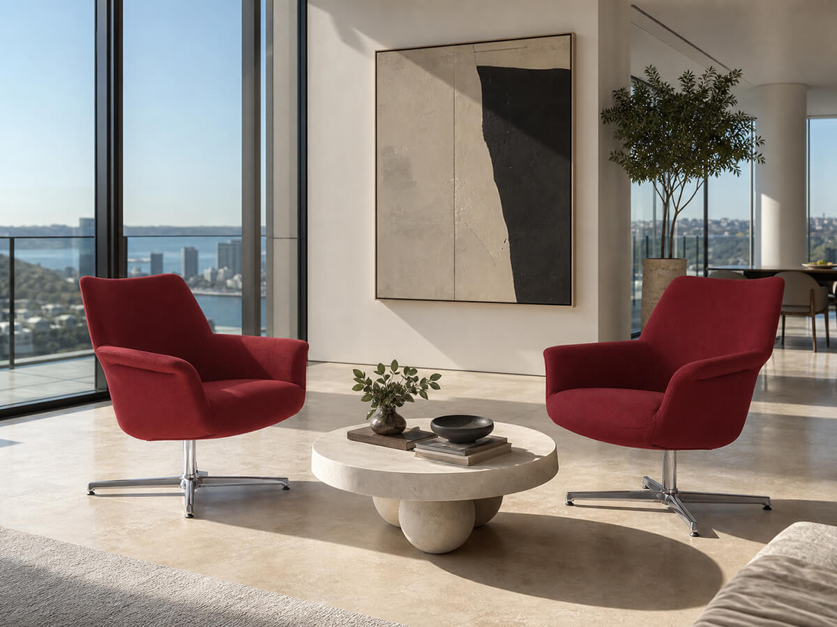Two Pimento red swivel armchairs in a contemporary lounge setting