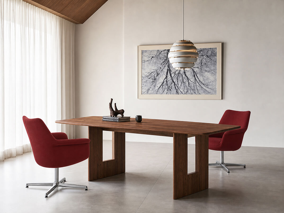 Pimento red swivel armchairs around a modern dining table in a contemporary dining room