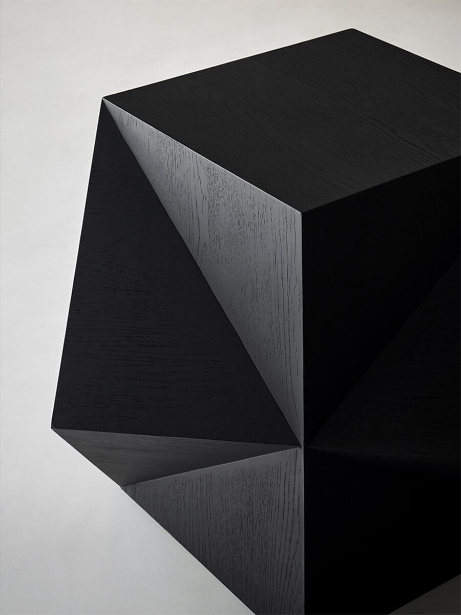 Close-up of the geometric sculptural design on the Prism Sculptural Side Table