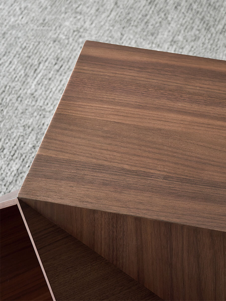 Close-up of the walnut top surface on the Prism Sculptural Side Table