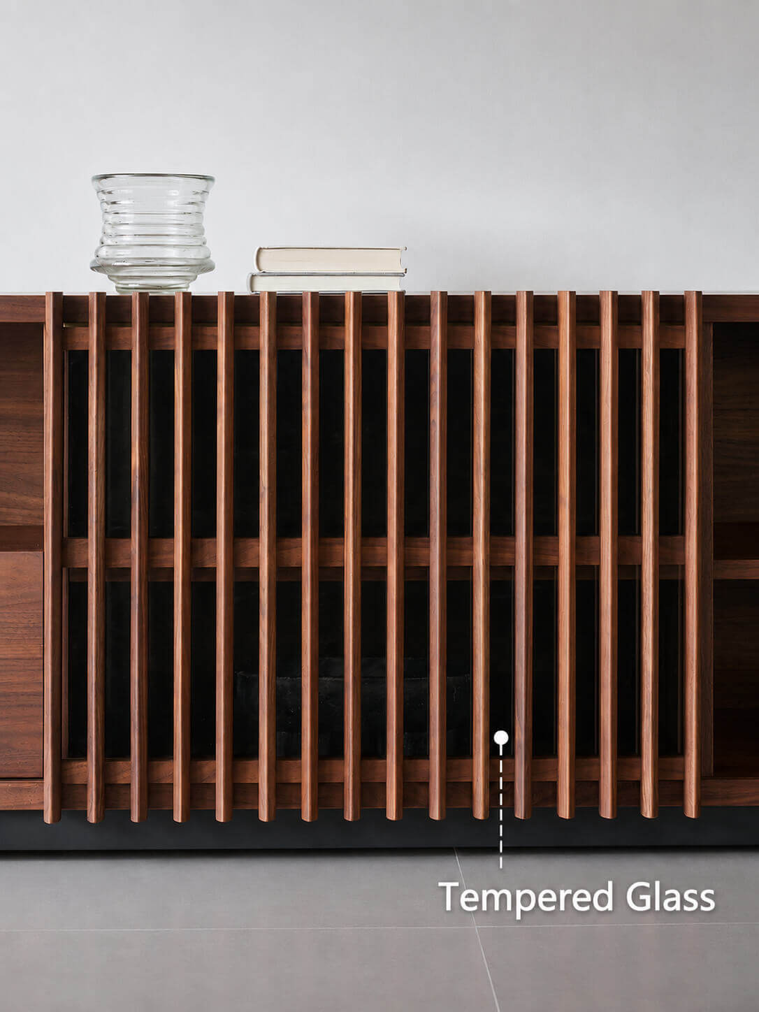 Tempered glass detail behind the solid walnut sliding doors of the Rhythm TV Unit