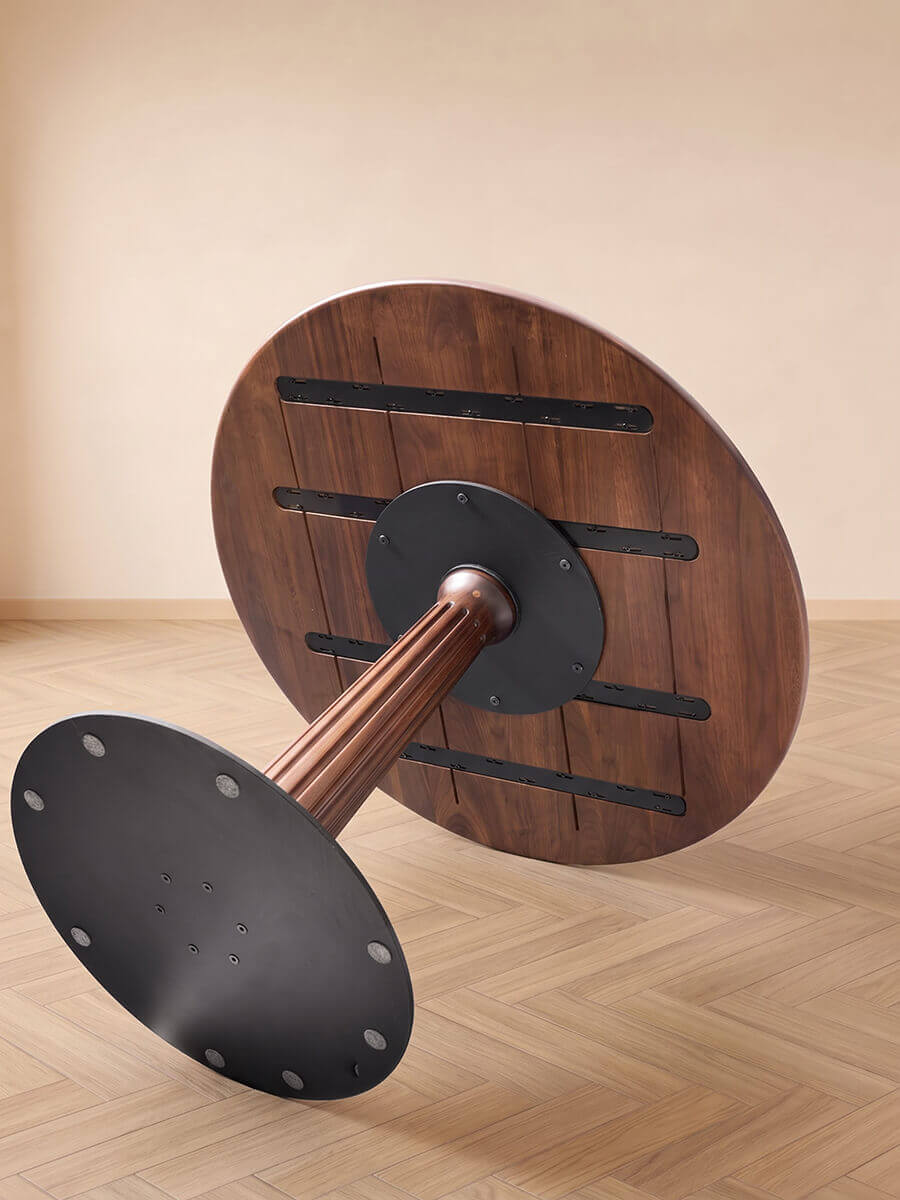Underside construction of Riva Round Dining Table with metal mounting plate and disc base