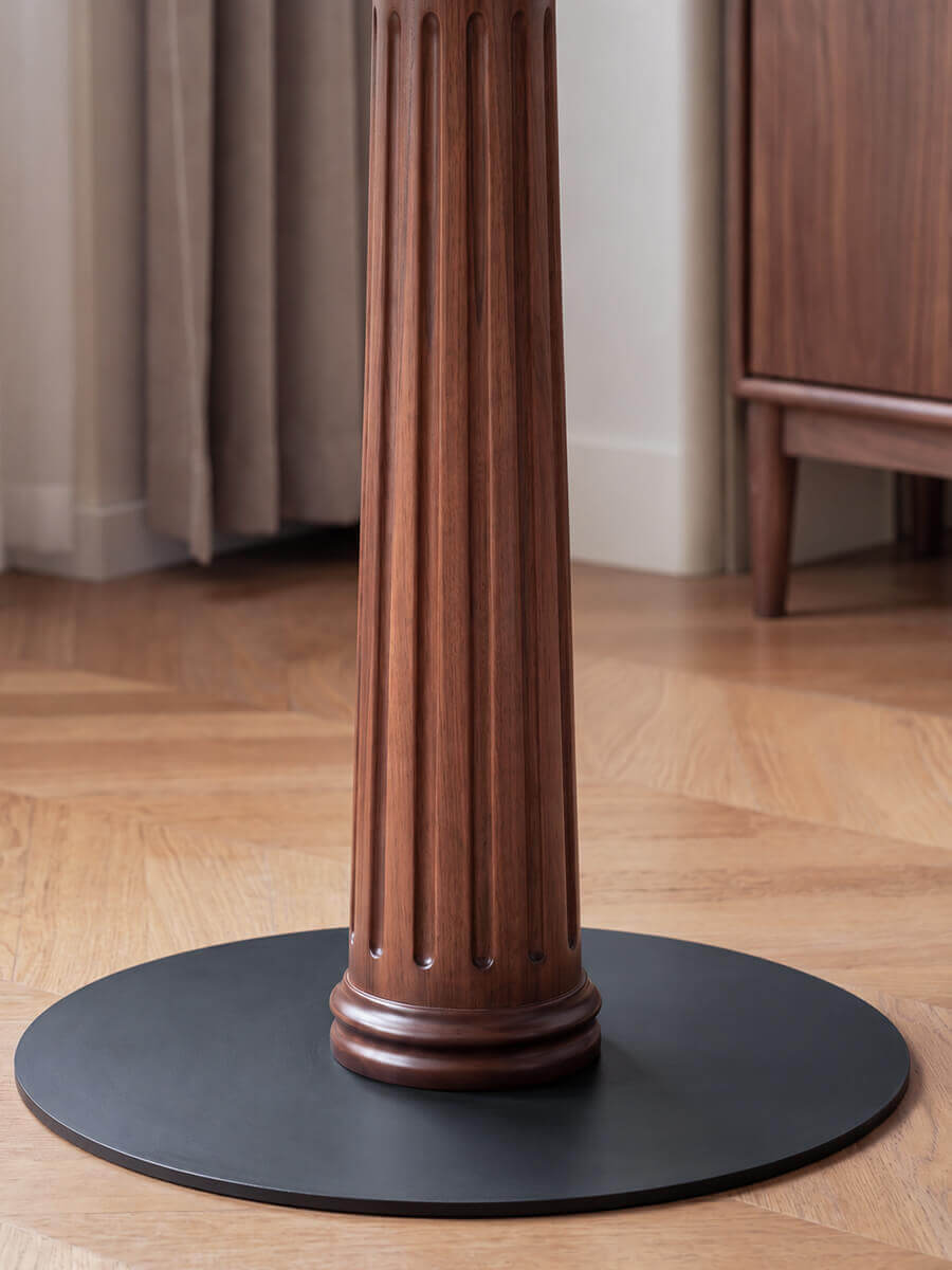 Solid walnut fluted pedestal detail on the Riva Round Dining Table