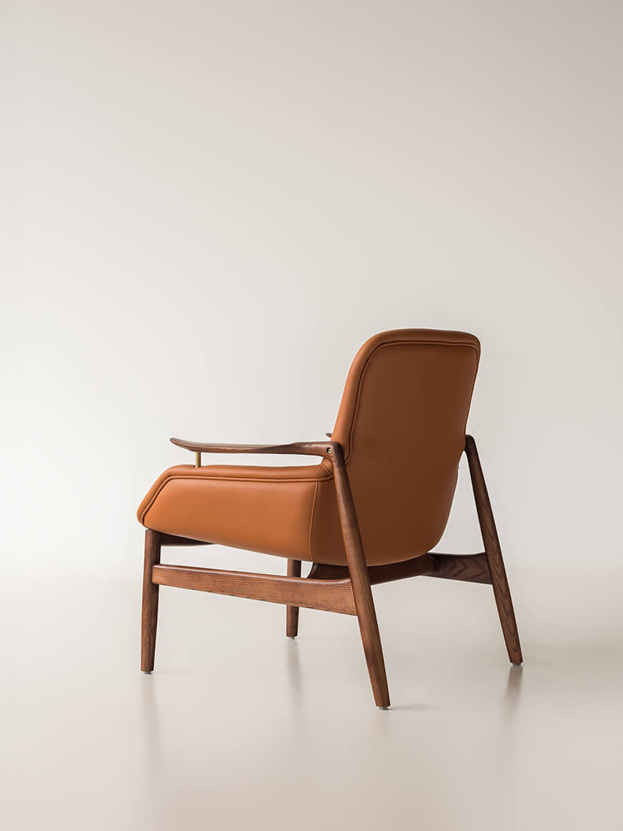 Rear view of Robin Leather Armchair showing exposed timber frame