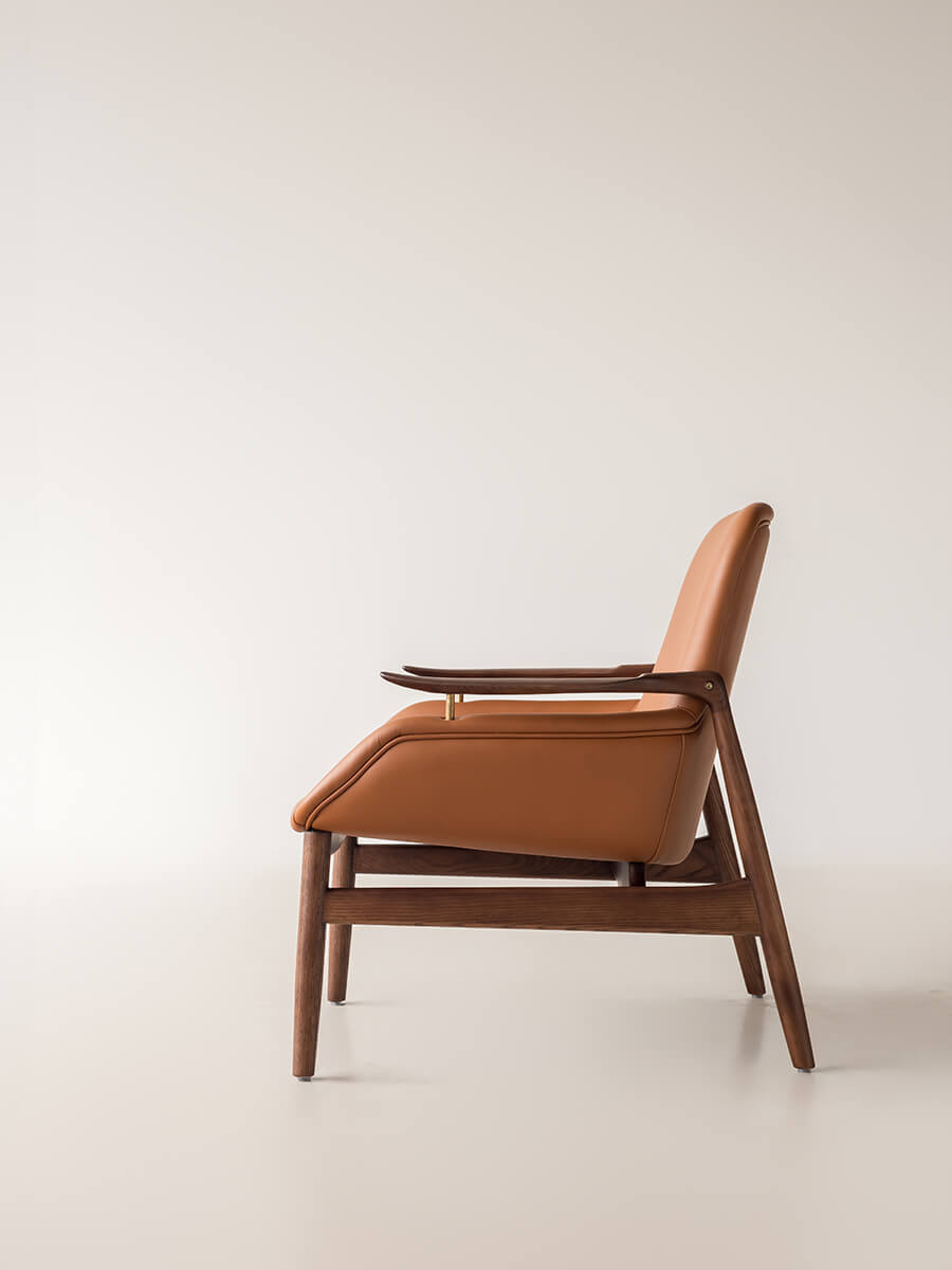 Side view of Robin Leather Armchair with solid ash wood frame