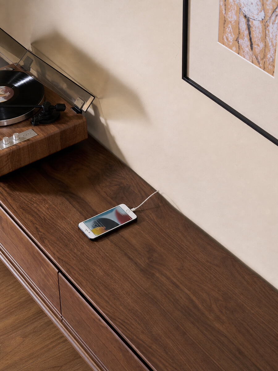Rowan Solid Walnut TV Unit top surface and dark glass detail