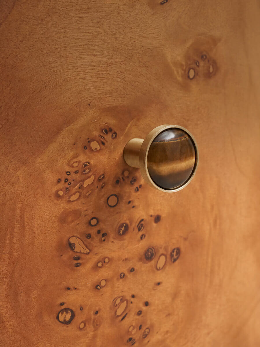 Natural burl veneer drawer front on the Sable bedside table