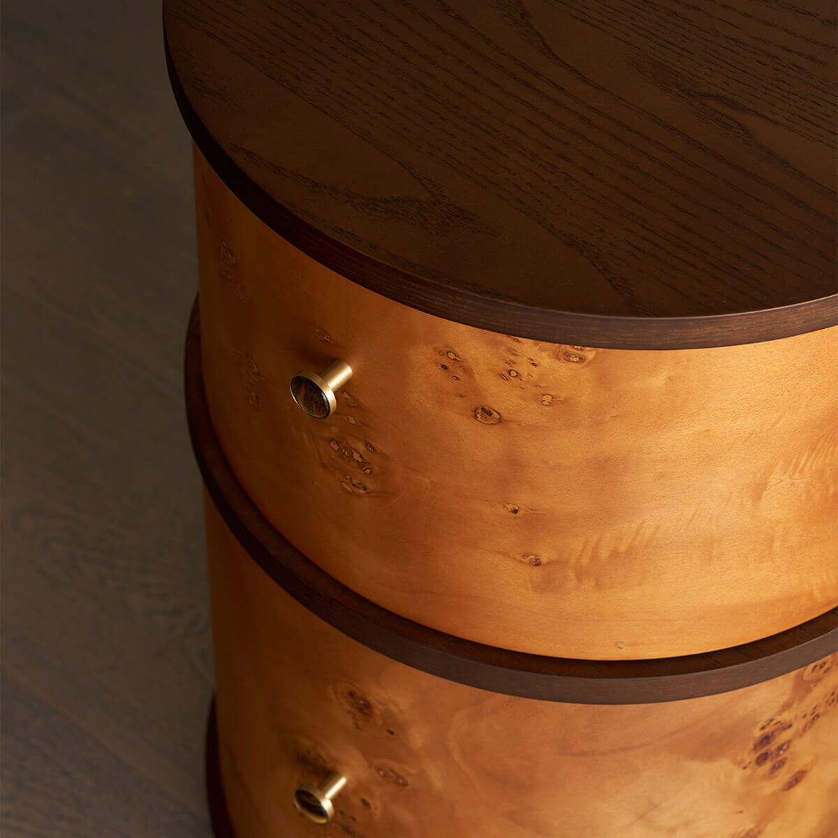 Curved burl veneer drawers of the Sable bedside table