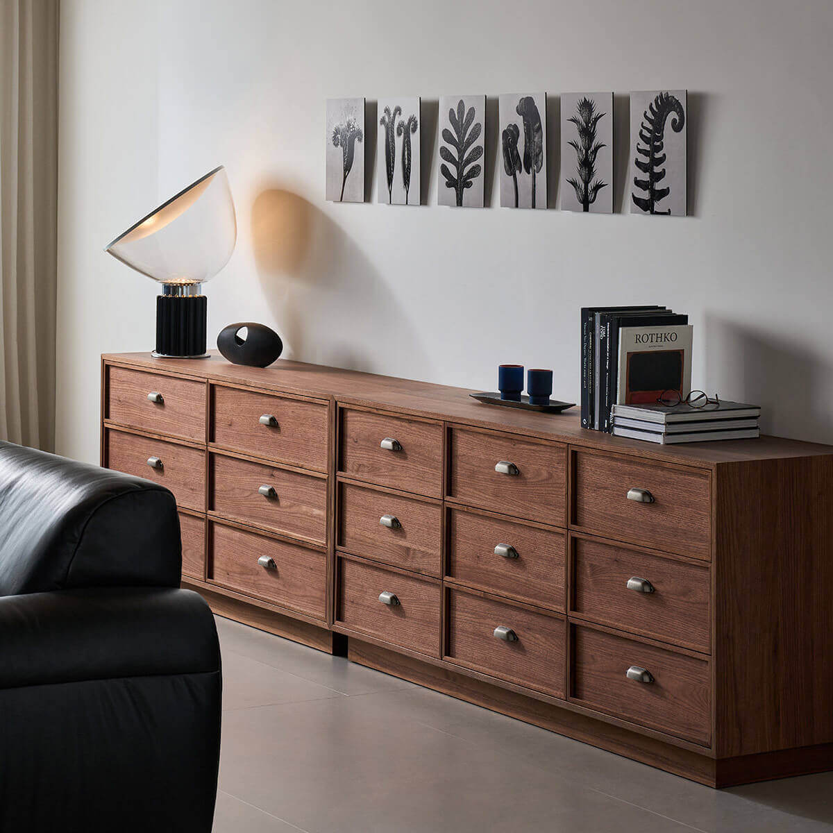 Sala Walnut 9 Drawer Chest of Drawers styled in a modern bedroom