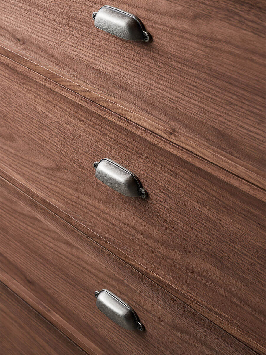 Vintage-inspired metal handle detail on the Sala Walnut Chest of Drawers
