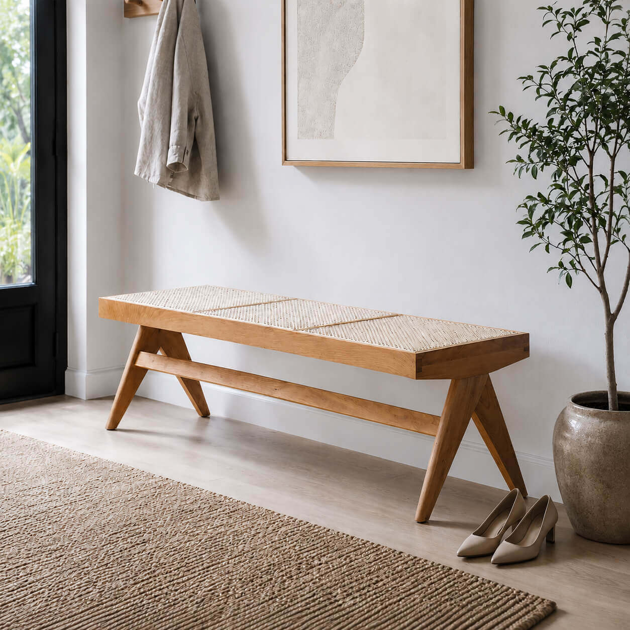 Sandy solid timber bench with natural rattan seat in a modern entryway