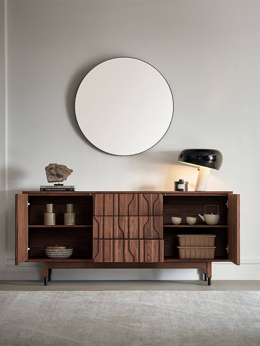 Interior storage detail of the Siena sideboard with doors open in living space