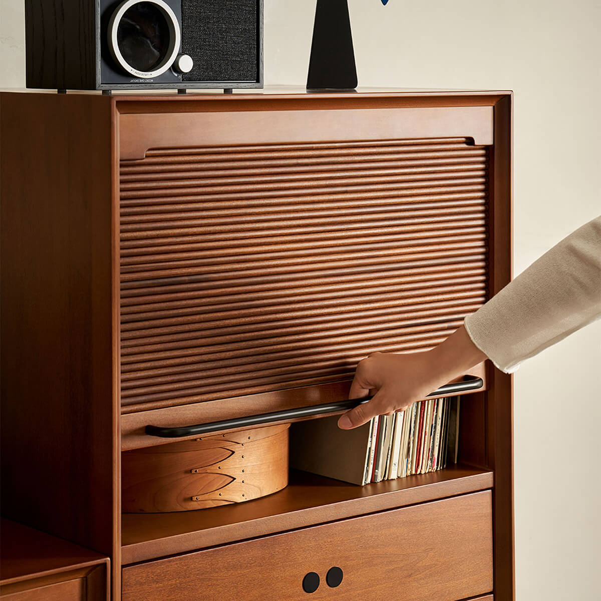 Tambour cabinet with roll-top door open to reveal record storage