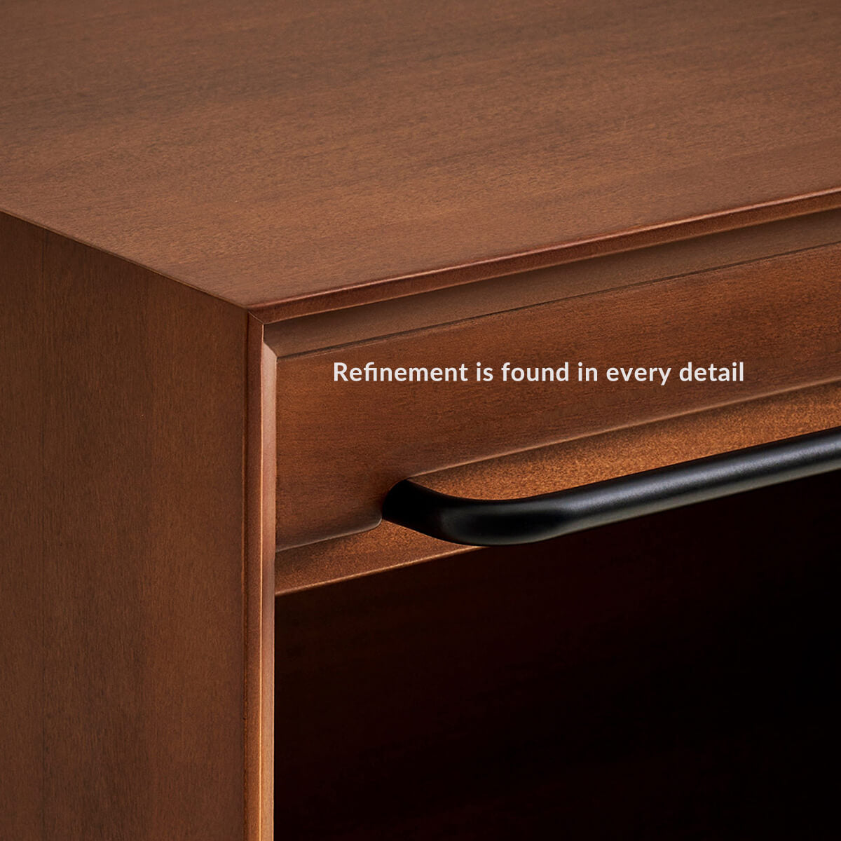 Close-up of rounded cabinet edge and recessed roll-top handle